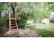Backyard treehouse in a lush green setting at 7987 Durango St, Denver, CO 80221
