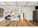 Bright bedroom with wood floors, large windows, and open design to the living space at 154 Apache Rd, Evergreen, CO 80439