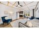 Cozy living room with wood ceiling, plush rug, blue accents, and open floor plan to kitchen at 154 Apache Rd, Evergreen, CO 80439