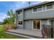 Inviting backyard featuring a spacious patio, a table and chairs, and direct access to the home through sliding glass doors at 4140 Monroe Dr # C, Boulder, CO 80303
