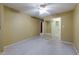 Spacious bedroom featuring neutral tones, plush carpet, and a ceiling fan at 4140 Monroe Dr # C, Boulder, CO 80303