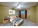 Virtually staged bedroom with ceiling fan, window views, soft textures, and calming colors is ready for relaxation at 4140 Monroe Dr # C, Boulder, CO 80303