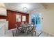 Virtually staged dining area with sliding glass doors to the backyard deck, perfect for indoor-outdoor meals at 4140 Monroe Dr # C, Boulder, CO 80303