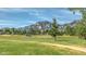Scenic community green space with a walking path and mountain views at 4140 Monroe Dr # C, Boulder, CO 80303