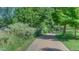 Scenic community green space featuring a walking path lined with lush trees and greenery at 4140 Monroe Dr # C, Boulder, CO 80303