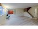 Bright living room features durable floors, large windows, and convenient access to both the front door and staircase at 4140 Monroe Dr # C, Boulder, CO 80303