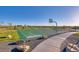 Outdoor basketball court with adjacent walking path and seating at 5525 Riverbend Ave, Firestone, CO 80504