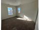 Well-lit bedroom with neutral wall paint and carpeted floor at 5525 Riverbend Ave, Firestone, CO 80504