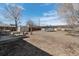 Expansive backyard with fire pit, patio and trampoline perfect for outdoor activities and relaxation at 3095 W Harvard Ave, Denver, CO 80219