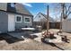 Charming backyard featuring a patio, fire pit, and seating area, ideal for outdoor entertaining at 3095 W Harvard Ave, Denver, CO 80219