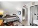 Attic bedroom featuring a futon and slanted ceilings at 3095 W Harvard Ave, Denver, CO 80219