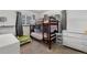 This room features a wood bunk bed, bright window, and comfortable furnishings at 3095 W Harvard Ave, Denver, CO 80219