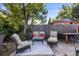 Inviting backyard patio featuring comfortable seating and a charming outdoor dining area at 7216 S Lincoln Way, Centennial, CO 80122