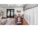 Elegant dining area featuring a large wooden table, comfortable seating, and stylish decor at 7216 S Lincoln Way, Centennial, CO 80122