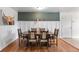 Traditional dining room featuring hardwood floors, decorative wall accents, and seating for six at 7216 S Lincoln Way, Centennial, CO 80122