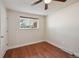 Bright bedroom with a window, hardwood floors and ceiling fan at 3150 W Mexico Ave, Denver, CO 80219