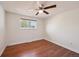 Bedroom with wood flooring and a window providing natural light at 3150 W Mexico Ave, Denver, CO 80219