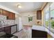 Kitchen featuring stainless steel appliances, granite countertops and an opening to the living room at 3150 W Mexico Ave, Denver, CO 80219