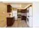 Updated kitchen features stainless steel appliances, granite countertops, and in-unit washer/dryer at 3150 W Mexico Ave, Denver, CO 80219