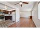 Open-concept living area with a seamless transition to the updated kitchen, hardwood floors, and ample natural light at 3150 W Mexico Ave, Denver, CO 80219