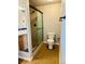 Bathroom showcasing tile flooring, a walk-in shower, and modern fixtures, offering functionality at 7440 S Blackhawk St # 207, Englewood, CO 80112