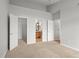 Large bedroom showcases doorways to bathroom and walk-in closet at 7440 S Blackhawk St # 207, Englewood, CO 80112