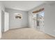 Neutral bedroom featuring a sliding glass door to balcony and a secondary window for natural light at 7440 S Blackhawk St # 207, Englewood, CO 80112