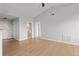 Spacious living room featuring hardwood floors and multiple doorways leading to various parts of the home, enhancing flow at 7440 S Blackhawk St # 207, Englewood, CO 80112