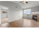 Bright living room featuring vaulted ceilings, a cozy fireplace, and hardwood floors, creating an inviting and stylish space at 7440 S Blackhawk St # 207, Englewood, CO 80112
