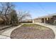 Backyard featuring a small patch of grass and mulch area at 3530 W 95Th Ave, Westminster, CO 80031