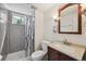 Bathroom featuring neutral colored tile shower and vanity with mirror at 3530 W 95Th Ave, Westminster, CO 80031