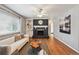 Stylish living room with hardwood floors, a brick fireplace, and built-in shelves at 3530 W 95Th Ave, Westminster, CO 80031