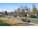 A neighborhood street showing a variety of houses and several parked and moving vehicles at 3530 W 95Th Ave, Westminster, CO 80031