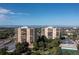 Two-building complex with surrounding green space and mountain views at 7877 E Mississippi Ave # 604, Denver, CO 80247