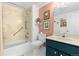 Clean bathroom with updated vanity and a tub shower combo at 7877 E Mississippi Ave # 604, Denver, CO 80247