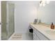 Bright bathroom with vanity, large mirror, and walk-in shower at 7877 E Mississippi Ave # 604, Denver, CO 80247