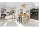 Bright dining room with a wooden table and dark brown hutch at 7877 E Mississippi Ave # 604, Denver, CO 80247