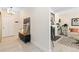 Light and airy entryway with view into living room and fireplace at 7877 E Mississippi Ave # 604, Denver, CO 80247