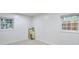 Bedroom with neutral carpet, white walls and trim, and two bright windows at 1325 Dayton St, Aurora, CO 80010