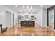 Modern kitchen with stainless steel appliances, a central island, and hardwood floors at 1325 Dayton St, Aurora, CO 80010