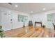 Bright living room with hardwood floors, fresh white walls, and large windows at 1325 Dayton St, Aurora, CO 80010