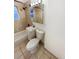 Cozy full bathroom featuring tiled walls and floors, a vanity, and a shower at 1920 Alton St, Aurora, CO 80010