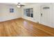 Bright living room with hardwood floors and a large sliding glass door at 1920 Alton St, Aurora, CO 80010