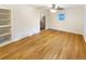 Bright living room featuring hardwood floors, a ceiling fan, and an open layout at 1920 Alton St, Aurora, CO 80010