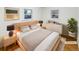 This is a virtually staged main bedroom, boasting a cozy modern style, two windows, and neutral tones at 1920 Alton St, Aurora, CO 80010