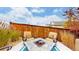 Cozy backyard patio with fire pit and seating area, perfect for outdoor entertaining at 3158 S Nepal Way, Aurora, CO 80013