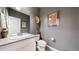 Clean bathroom with single vanity and gray walls at 3158 S Nepal Way, Aurora, CO 80013