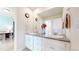 Double vanity bathroom with gray counters and white cabinets at 3158 S Nepal Way, Aurora, CO 80013