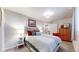 Bright bedroom with a double bed and dresser at 3158 S Nepal Way, Aurora, CO 80013