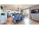 Kitchen and dining area with hardwood floors and access to a deck at 3158 S Nepal Way, Aurora, CO 80013